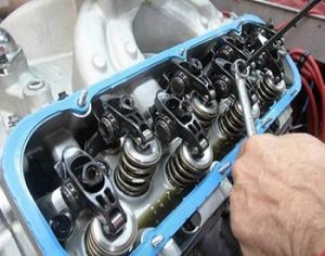 Rocker arms and valve adjustment