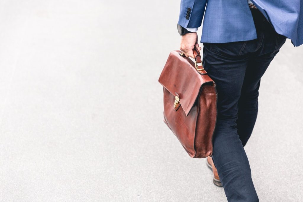 person walking with briefcase