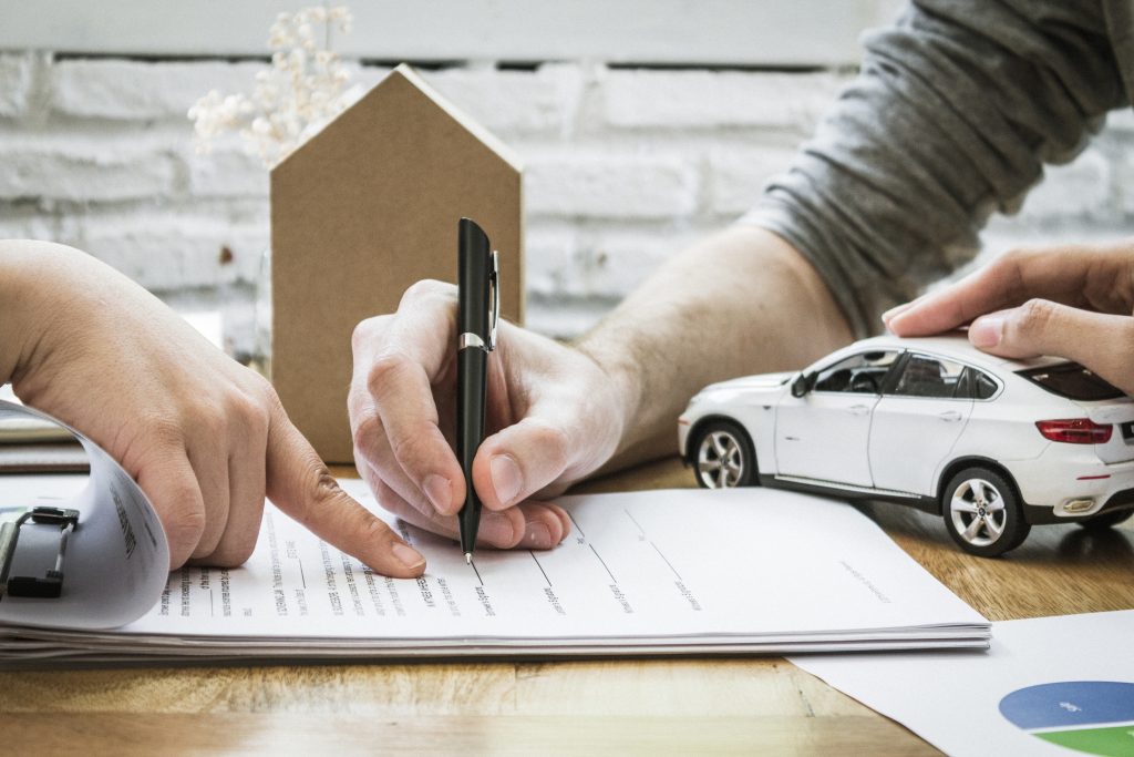 person completing car loan form