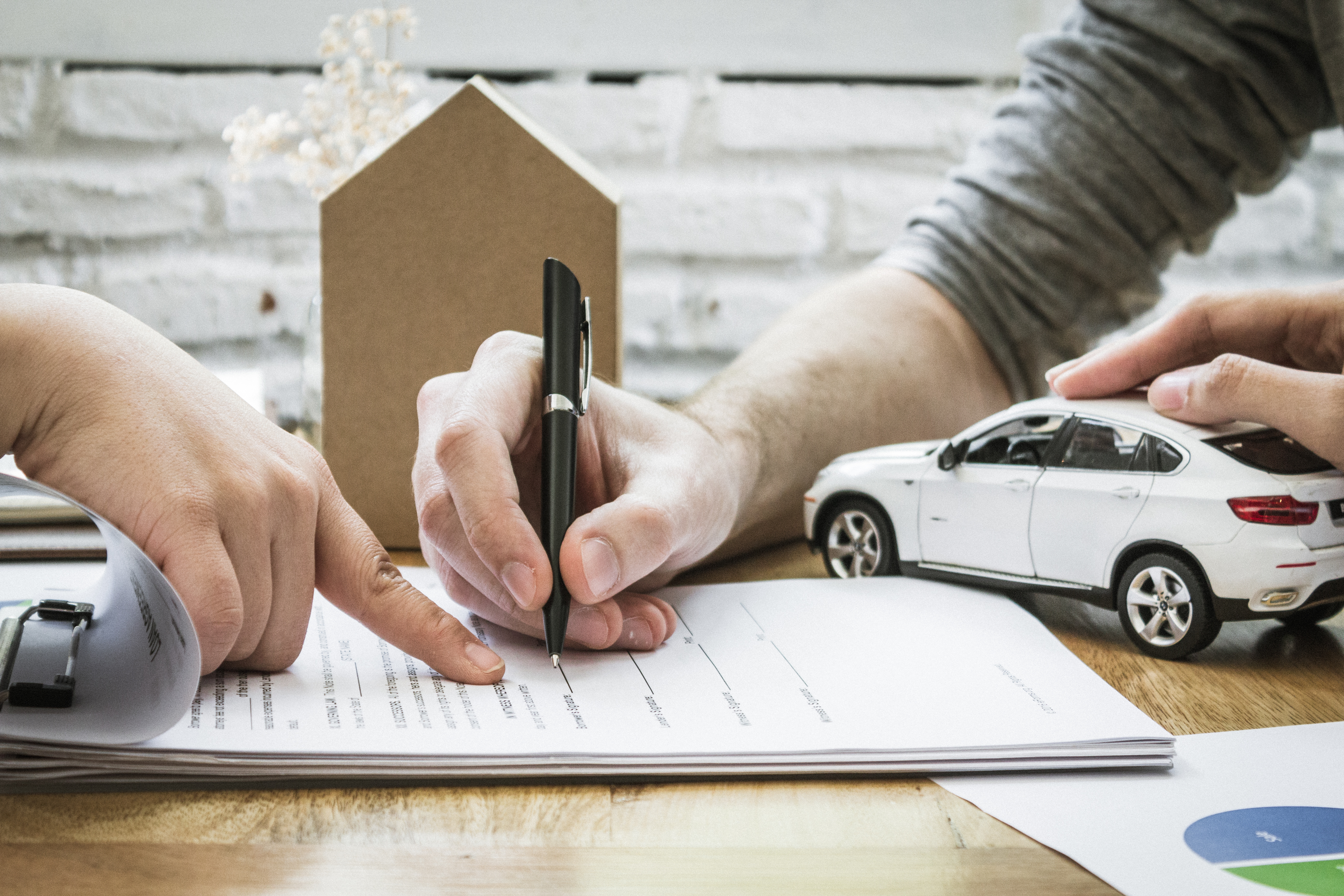 person completing car loan form