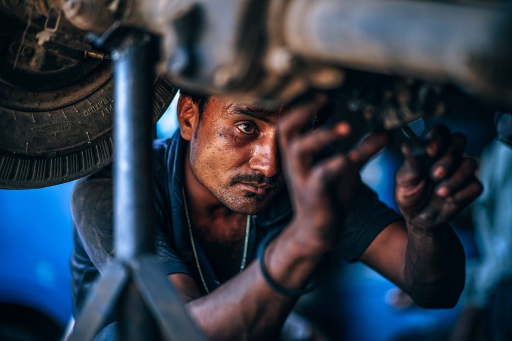 mechanic working on car