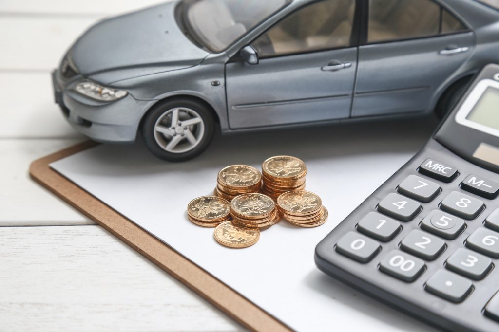 car with coins and calculator