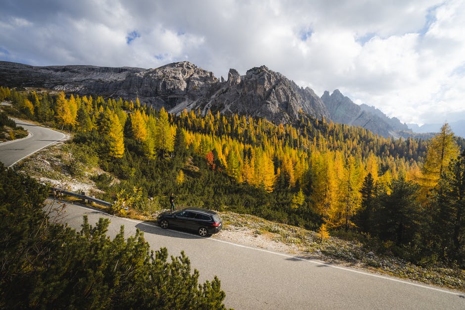 car on side of road in mountains