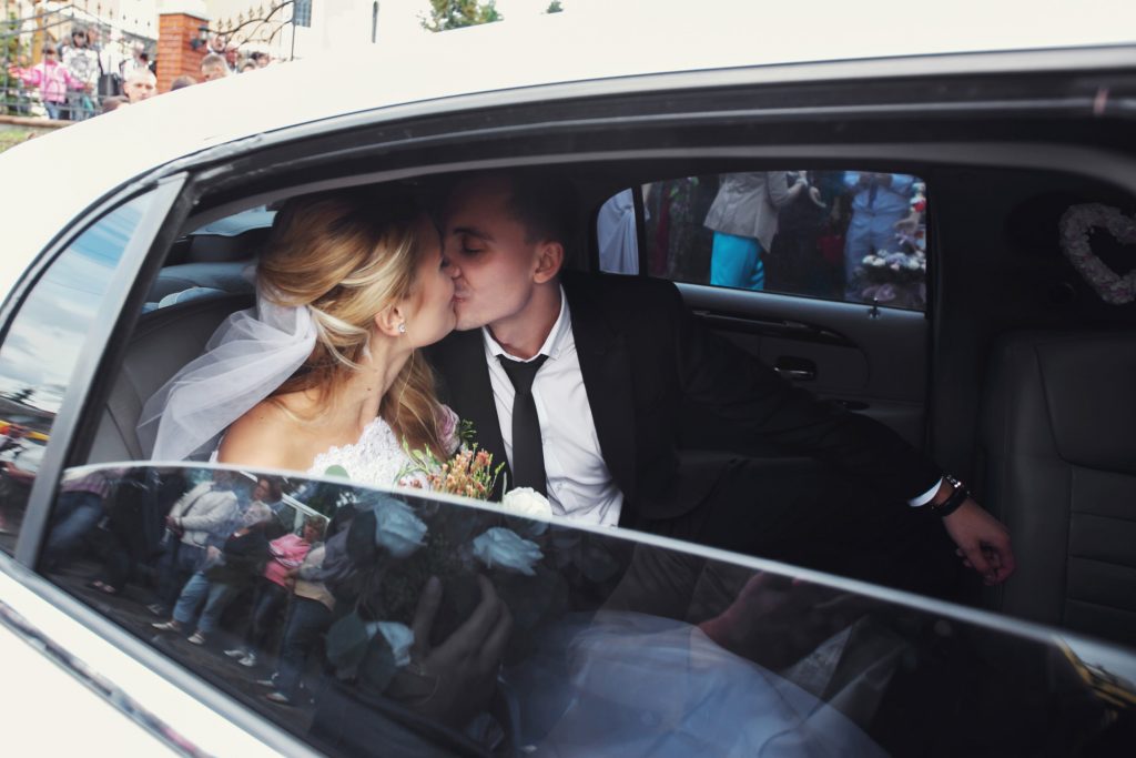 wedding couple in car