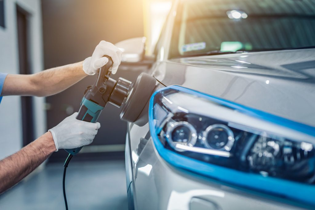 man polishing automotive paint job