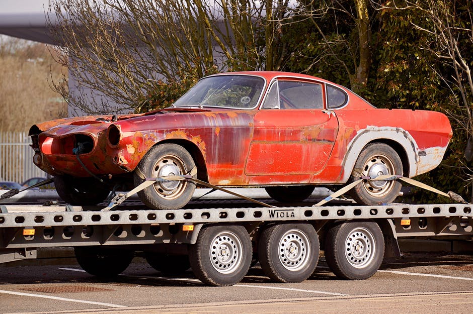 car being towed on flatbed