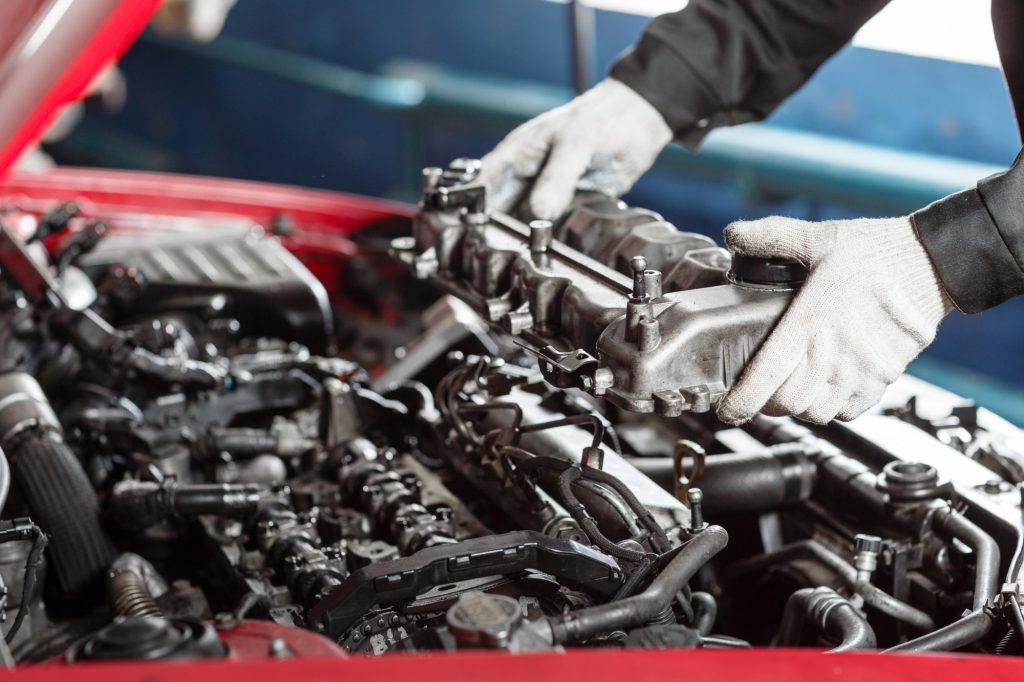 mechanic working on engine