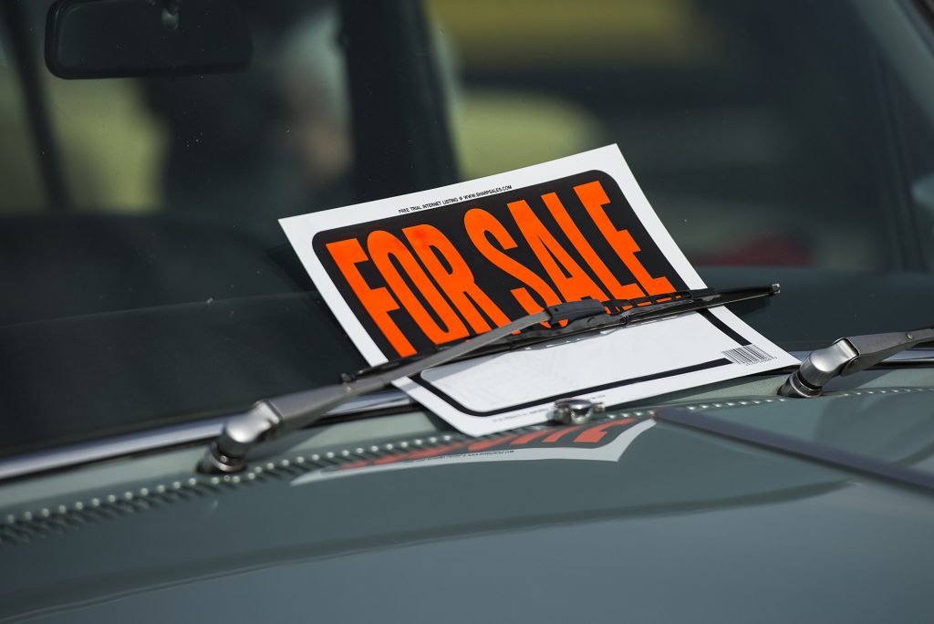 for sale sign on car window