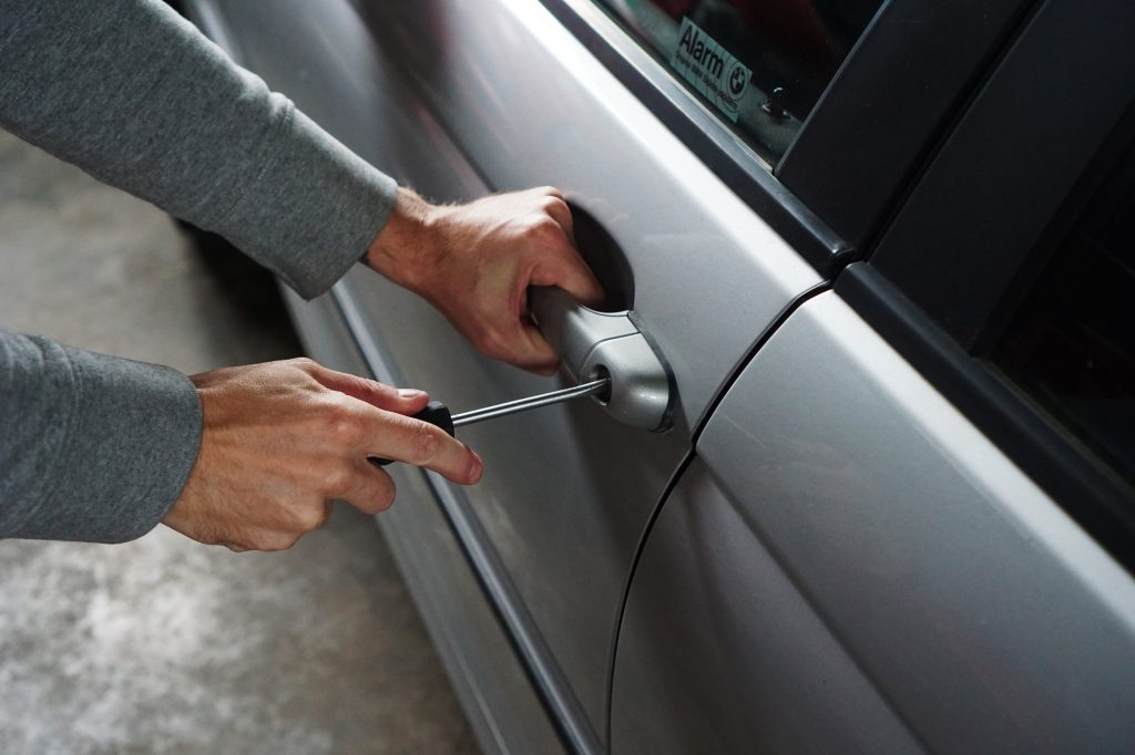 locked car and person with screw driver