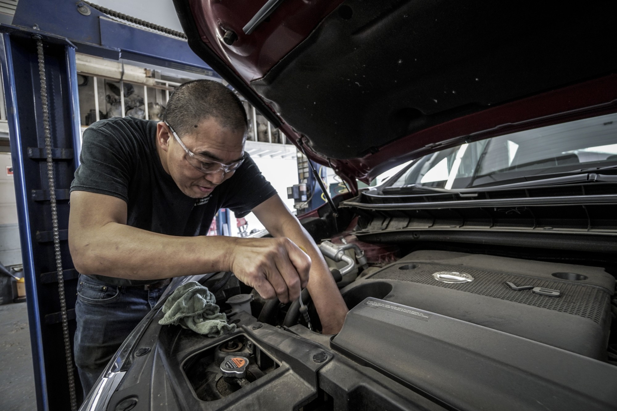 Man Checking Car Engine